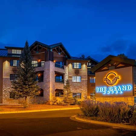 The Grand Hotel At The Grand Canyon Тусан Екстериор снимка The image shows a building featuring a sign that reads "The Grand." The structure appears to be a hotel or lodge, characterized by a combination of stone and wooden features. It is illuminated with warm lighting, which creates an inviting atmosphere.